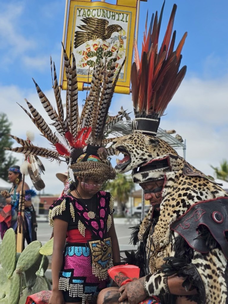 Calpulli Yaocuauhtli dancers with Yaocuauhtli banner and jaguar regalia